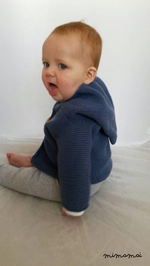 Knitted baby cardigan with pixie hood, knitted in airforce blue
