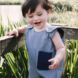 Baby dungarees with purple pocket