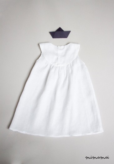 White linen baby dress with Bella brooch