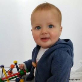 Knitted baby cardigan with pixie hood, knitted in airforce blue