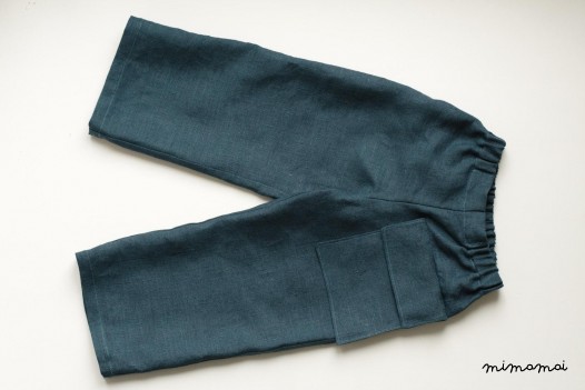 Linen teal trousers with a hanging pocket