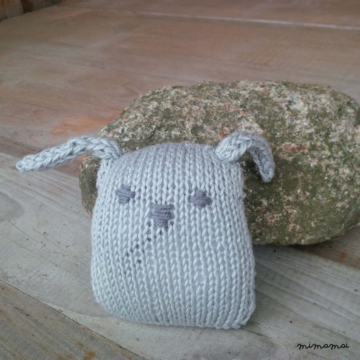 Baby shoes and knitted rabbit, handmade knitwear of organic cotton, grey