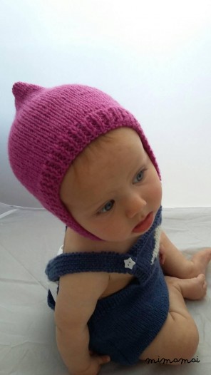 Baby pixie cap, knitted baby hat in fuscia pink wool with button closure