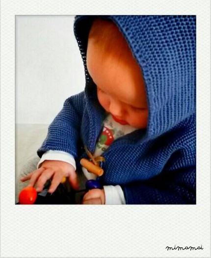 Knitted baby cardigan with pixie hood, knitted in airforce blue
