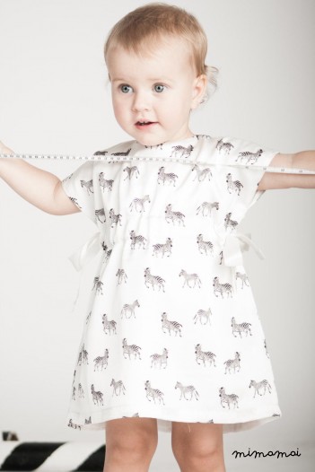 Vanilla baby dress with zebra print