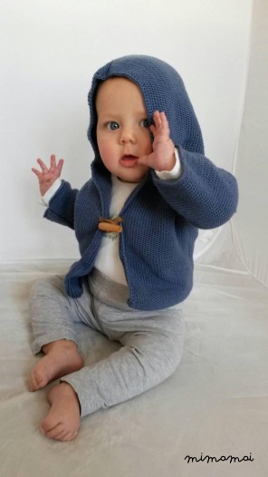 Knitted baby cardigan with pixie hood, knitted in airforce blue