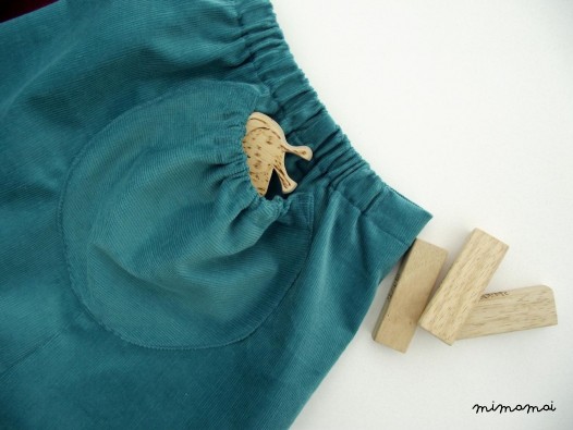 Natural cord skirt with big round ruffled pockets